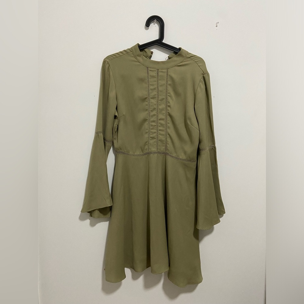 An olive green flows dress from Kazo in size Medium